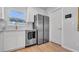 Modern kitchen features stainless steel appliances, white cabinets, and stylish hardware at 1710 Shore Acres Ne Blvd, St Petersburg, FL 33703