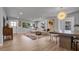 Spacious living room features a sectional sofa, dining table, and ample natural light at 1710 Shore Acres Ne Blvd, St Petersburg, FL 33703