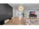 Open-concept living room with hardwood floors, stylish decor, and a connected dining area at 1710 Shore Acres Ne Blvd, St Petersburg, FL 33703