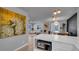 Open living space combining kitchen, living, and dining areas for seamless entertainment and relaxation at 1710 Shore Acres Ne Blvd, St Petersburg, FL 33703