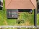Aerial view of backyard featuring a screened lanai and private outdoor space at 17249 Star Banks St, Wimauma, FL 33598