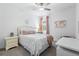 Cozy bedroom features white walls, a ceiling fan, and natural light at 17249 Star Banks St, Wimauma, FL 33598