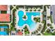 Overhead view of community swimming pools surrounded by trees and lounge chairs for residents at 17249 Star Banks St, Wimauma, FL 33598