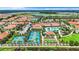 Aerial view of the community featuring tennis courts, a pool, and well-maintained landscaping at 17249 Star Banks St, Wimauma, FL 33598