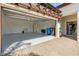 View of a clean, spacious garage with modern epoxy flooring and ample storage, ready for parking at 17249 Star Banks St, Wimauma, FL 33598