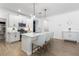 Beautiful kitchen with quartz countertops, island with seating, and stainless steel appliances at 17249 Star Banks St, Wimauma, FL 33598