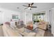 Bright living room with sliding glass doors to the lanai and stylish furnishings at 17249 Star Banks St, Wimauma, FL 33598
