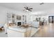Living room with fireplace and built-ins, flowing into the kitchen and dining areas at 17249 Star Banks St, Wimauma, FL 33598