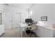 Bright home office featuring a large desk and an abundance of storage space at 17249 Star Banks St, Wimauma, FL 33598