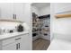 Walk-in pantry with shelving and countertop space, adjacent to the kitchen at 17249 Star Banks St, Wimauma, FL 33598