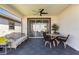 Covered screened patio features an outdoor dining and lounge area, providing a comfortable space for relaxation at 17249 Star Banks St, Wimauma, FL 33598
