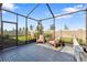 Relaxing screened-in patio with outdoor seating and a hammock, perfect for enjoying the backyard at 17249 Star Banks St, Wimauma, FL 33598