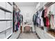 Well-organized walk-in closet with custom shelving, drawers, and ample storage space for clothing and accessories at 17249 Star Banks St, Wimauma, FL 33598