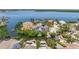 Stunning aerial shot of waterfront home with boat dock and lush landscape at 1811 Bayou Grande Ne Blvd, St Petersburg, FL 33703