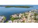 Beautiful waterfront property featuring a large home and lush trees at 1811 Bayou Grande Ne Blvd, St Petersburg, FL 33703