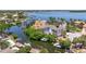 Stunning waterfront property with private boat docks and lush landscaping in a tropical setting at 1811 Bayou Grande Ne Blvd, St Petersburg, FL 33703