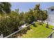 Large, well-maintained backyard with mature trees and dock at 1811 Bayou Grande Ne Blvd, St Petersburg, FL 33703