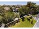 Aerial view of backyard with lush greenery, boats on the canal, and tiki hut entertainment area at 1811 Bayou Grande Ne Blvd, St Petersburg, FL 33703