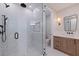 Modern bathroom featuring a glass-enclosed shower, vanity with white marble countertop and sleek fixtures at 1811 Bayou Grande Ne Blvd, St Petersburg, FL 33703