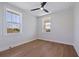 This light and airy bedroom features hardwood floors, two large windows, and natural light at 1811 Bayou Grande Ne Blvd, St Petersburg, FL 33703