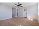 Bedroom featuring an open layout, hardwood floors, modern lighting and seamless transition to bathroom at 1811 Bayou Grande Ne Blvd, St Petersburg, FL 33703