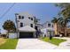 Charming two-story home with a well-manicured lawn, a two-car garage and stylish exterior at 1811 Bayou Grande Ne Blvd, St Petersburg, FL 33703