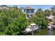 Charming two-story waterfront home with deep-water dock featuring convenient boat lift at 1811 Bayou Grande Ne Blvd, St Petersburg, FL 33703