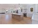 Open floor plan kitchen with stainless appliances, large island, and adjacent living area at 1811 Bayou Grande Ne Blvd, St Petersburg, FL 33703