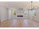 Spacious living room with a sleek fireplace, hardwood floors, and ample natural light at 1811 Bayou Grande Ne Blvd, St Petersburg, FL 33703