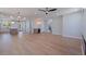 Open-concept living space featuring hardwood floors, a wet bar, and seamless flow to the kitchen at 1811 Bayou Grande Ne Blvd, St Petersburg, FL 33703