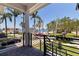 Balcony view showcasing palm trees and waterfront homes at 1811 Bayou Grande Ne Blvd, St Petersburg, FL 33703