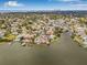 Expansive aerial view of waterfront neighborhood, highlighting bay access and tropical landscape at 1819 Bayou Grande Ne Blvd, St Petersburg, FL 33703