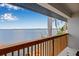 Balcony view overlooking the water with palm trees and beautiful blue skies at 1819 Bayou Grande Ne Blvd, St Petersburg, FL 33703