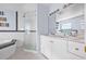 Bright bathroom featuring a glass-enclosed shower, double vanity, and modern fixtures at 1819 Bayou Grande Ne Blvd, St Petersburg, FL 33703