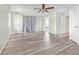 Large bedroom features stylish vinyl flooring, neutral walls, and multiple closets at 1819 Bayou Grande Ne Blvd, St Petersburg, FL 33703