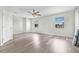 Bright, spacious bedroom with modern vinyl flooring, ample natural light, and a ceiling fan at 1819 Bayou Grande Ne Blvd, St Petersburg, FL 33703