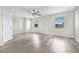 Bright, spacious bedroom with modern vinyl flooring, ample natural light, and a ceiling fan at 1819 Bayou Grande Ne Blvd, St Petersburg, FL 33703
