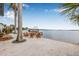 Home with a dock and patio featuring plenty of chairs and room for entertaining at 1819 Bayou Grande Ne Blvd, St Petersburg, FL 33703
