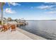 Waterfront dock featuring multiple boats and seating area overlooking a gorgeous water view at 1819 Bayou Grande Ne Blvd, St Petersburg, FL 33703