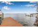 Private dock with calm water views and clear blue skies on a sunny day at 1819 Bayou Grande Ne Blvd, St Petersburg, FL 33703