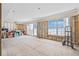 Spacious living room featuring large windows with ocean views, unfinished flooring, and an open layout at 1819 Bayou Grande Ne Blvd, St Petersburg, FL 33703