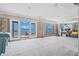 Spacious living room being remodeled with sliding glass doors offering stunning water views at 1819 Bayou Grande Ne Blvd, St Petersburg, FL 33703