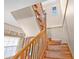 Classic wood staircase leading to the upper level, showcasing natural light and traditional design at 1819 Bayou Grande Ne Blvd, St Petersburg, FL 33703