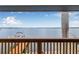 Stunning waterfront view from the balcony, showcasing a boat dock and expansive ocean at 1819 Bayou Grande Ne Blvd, St Petersburg, FL 33703