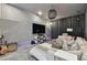 A modern basement with an entertainment center and gray decor at 1940 Floresta View Dr, Tampa, FL 33618