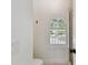 Bathroom featuring an arched window with bright, natural light and a shower with glass doors at 1940 Floresta View Dr, Tampa, FL 33618