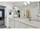 Bright bathroom features a double vanity, ample mirror space, and neutral decor at 1940 Floresta View Dr, Tampa, FL 33618