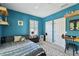 Bedroom with blue walls, floating shelves, and a bed with a patterned blanket near a window at 1940 Floresta View Dr, Tampa, FL 33618
