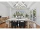 Elegant dining room with a decorative ceiling, stylish chandelier, and ample natural light at 1940 Floresta View Dr, Tampa, FL 33618