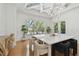 Bright dining room with hardwood floors, large windows, and stylish decor at 1940 Floresta View Dr, Tampa, FL 33618